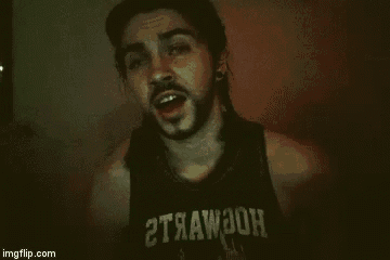 a man with a beard is wearing a black tank top with the word strawbon on it .