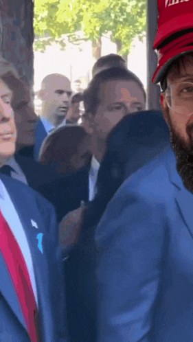 a man wearing a hat that says ' putin ' on it