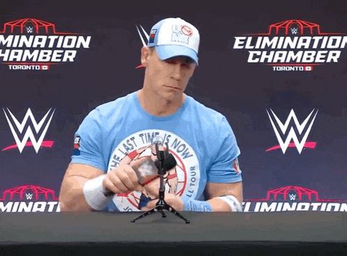 a man in a blue shirt that says the last time is now on it