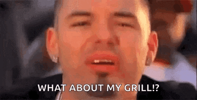 a close up of a man 's face with the words `` what about my grill ? '' written on it .