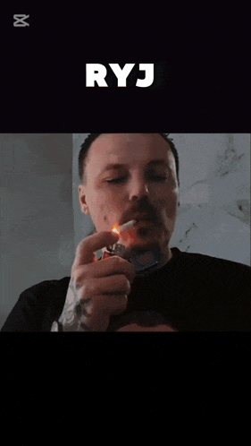 a man with a tattoo on his arm is smoking a cigarette with the caption ryj above him