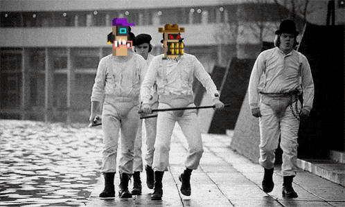 a group of men are walking down a sidewalk and one of them has a purple hat on