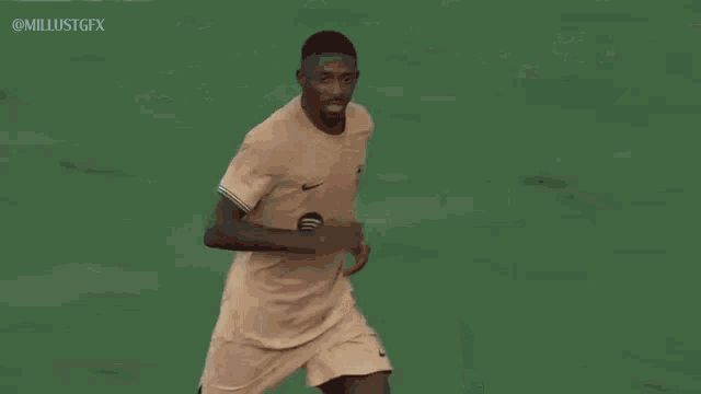 a couple of soccer players are hugging each other on a field .