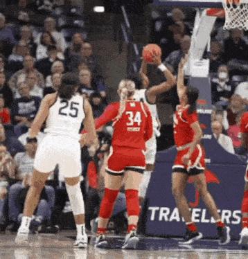 a female basketball player with the number 34 on her shirt