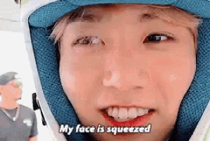 a close up of a person 's face with the words " my face is squeezed " above it