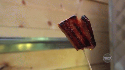 Bacon On A Stick GIF - Bacon Breakfast Delicious GIFs