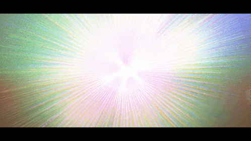 a colorful background with a burst of light