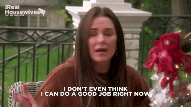 a woman is sitting in a chair with her eyes closed and says i don t even think i can do a good job