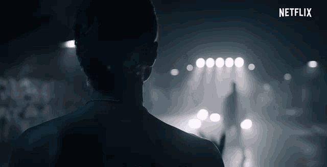 a netflix ad shows a man standing in front of a crowd