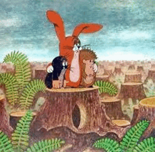 a group of cartoon characters are sitting on top of a tree stump .