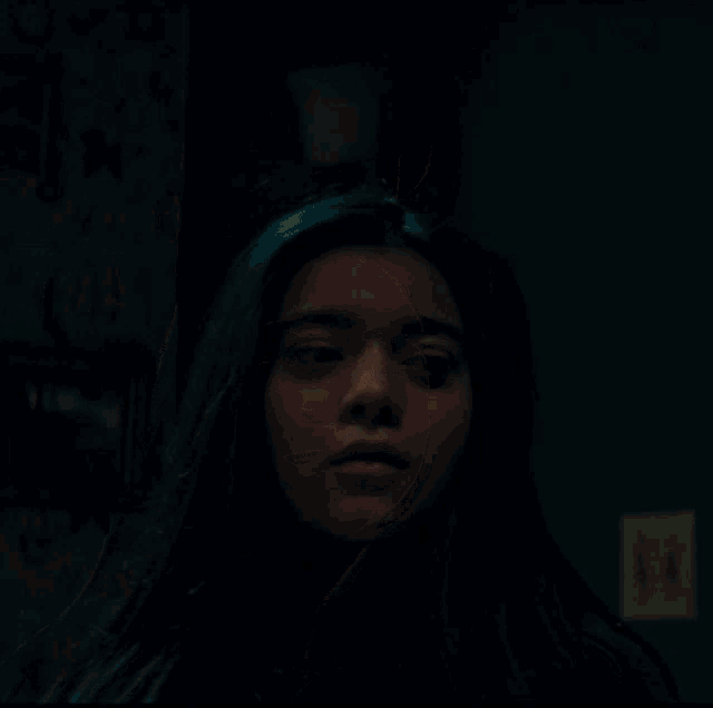 a woman with a light bulb floating above her head