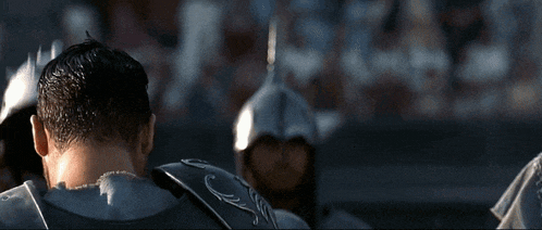a man in armor with the letter c on the back of his shoulder