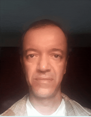 a close up of a man 's face with a blurred background