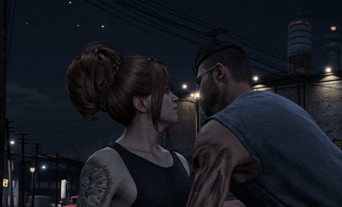 a man and a woman are looking into each other 's eyes in front of a building that has the letter e on it