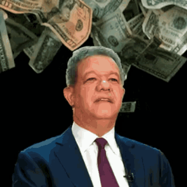 a man in a suit and tie is surrounded by money