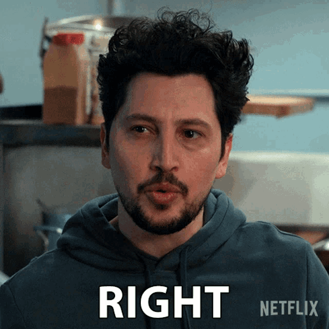 a man with a beard is wearing a hoodie that says right on the front