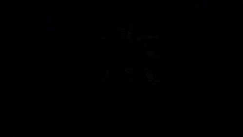 a close up of a person 's face in the dark