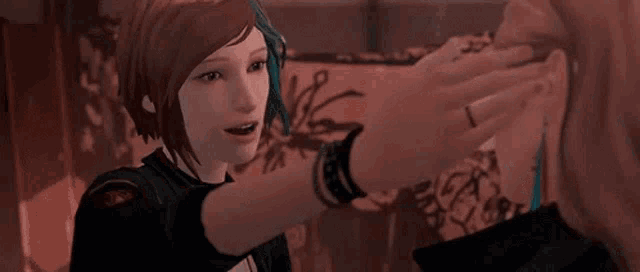 a woman is looking at another woman 's face in a video game while adjusting her earrings .