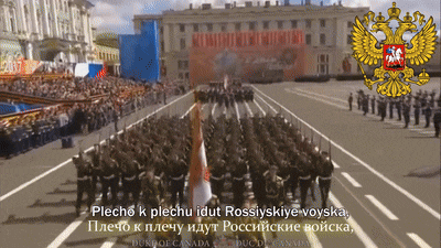 a large group of soldiers marching in a parade with a russian emblem