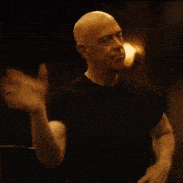 a bald man with a picture of a man and the words " not quite my true "