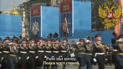 a group of soldiers march in front of a sign that says 2015 on it