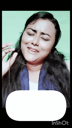 a woman wearing headphones is making a funny face in a video taken by inshot
