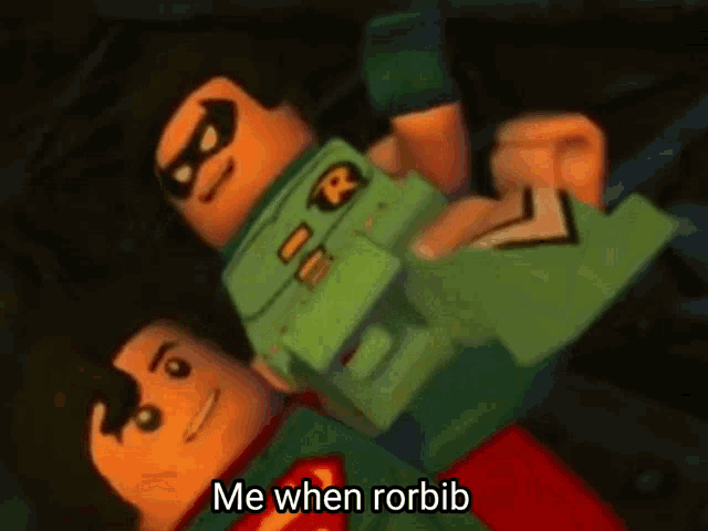 a lego robin is being held by superman