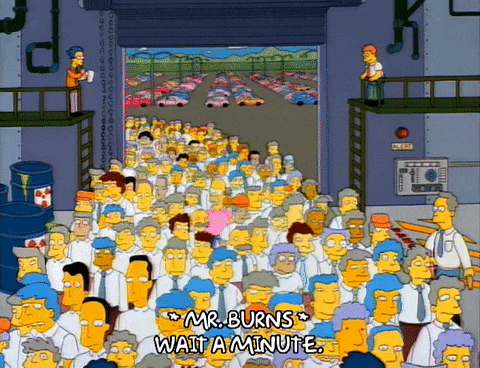 a large group of people are standing in a warehouse with the words " mr burns wait a minute "