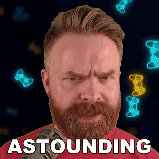 a man with a beard is standing in front of a microphone and the word astounding is written above him