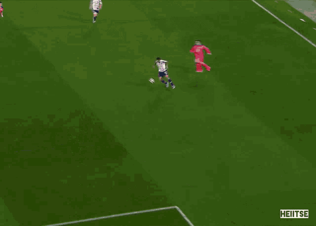 a soccer game is being played on a field that says heitse