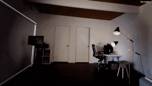 a room with a desk and chair and the word scrombe on the bottom right