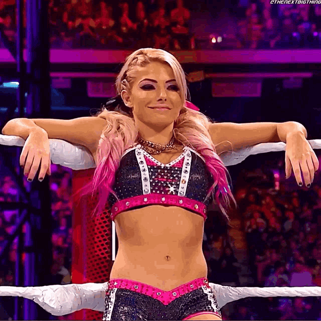 a woman in a wrestling ring with the next thing written on the bottom right