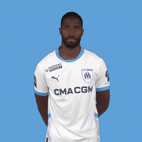 a man wearing a white shirt that says cma cgm