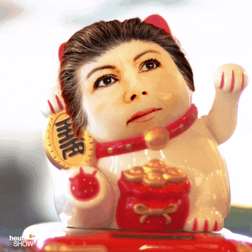 a statue of a woman holding a coin that says " hhh "