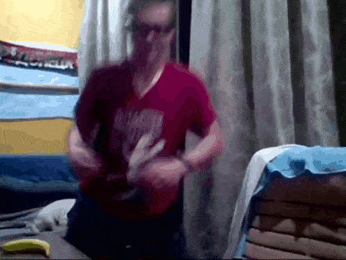 a man wearing a red shirt that says washington is dancing