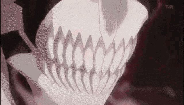 a close up of a person 's face with a skull mask on .