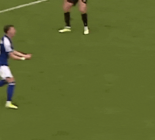 a soccer player with the number 35 on his shorts is celebrating a goal