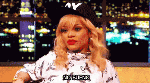 a woman wearing a hat that says ay on it