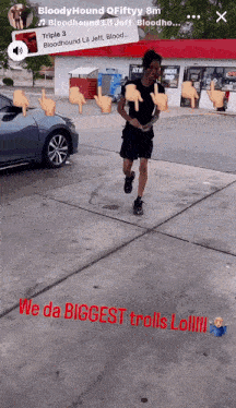 a man is running in front of a car with the words " we da biggest trolls lol "