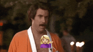 a man with a mustache is wearing an orange robe and holding a straw with an emoji of a woman behind him .