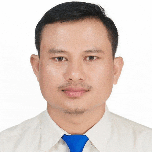 a man wearing a white shirt and blue tie
