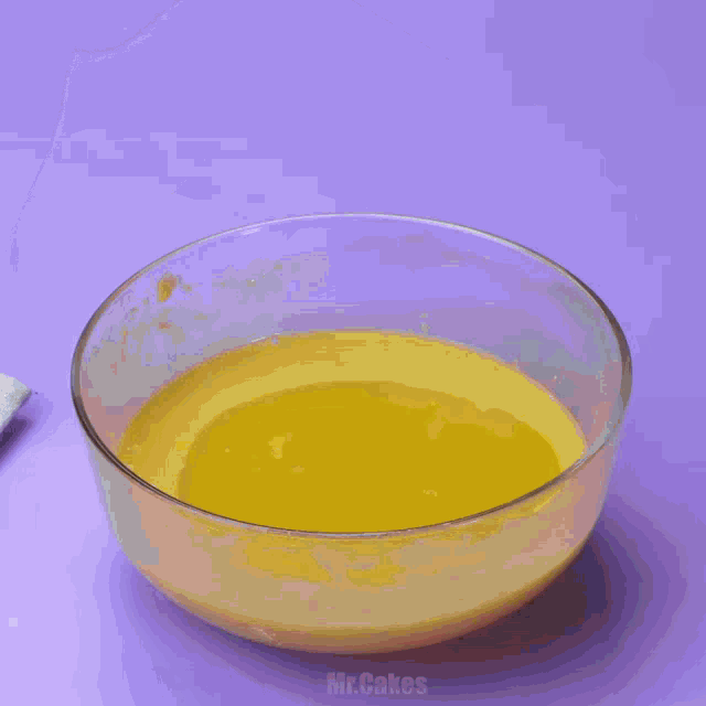 a person is pouring chocolate powder into a bowl of food .