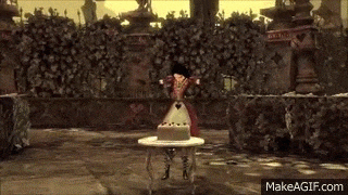 alice in wonderland is standing on a table with a cake on it .