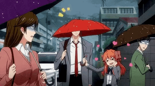 a group of people holding umbrellas in the rain .