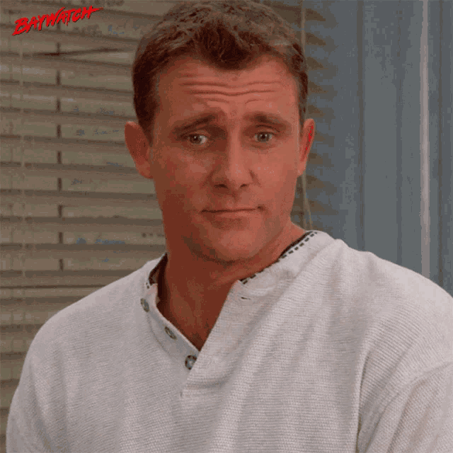 a man with the word baywatch on the bottom right