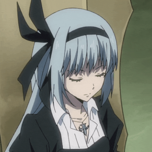 a girl with a black bow in her hair is looking down