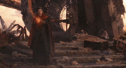 a man in a red robe is holding a pair of orange circles