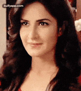 a close up of a woman 's face with a smile on her face