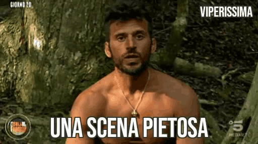 a shirtless man is sitting in the woods with the words una scena pietosa below him