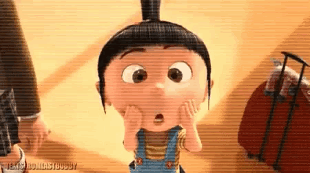 a cartoon character from despicable me is making a surprised face while standing next to a suitcase .